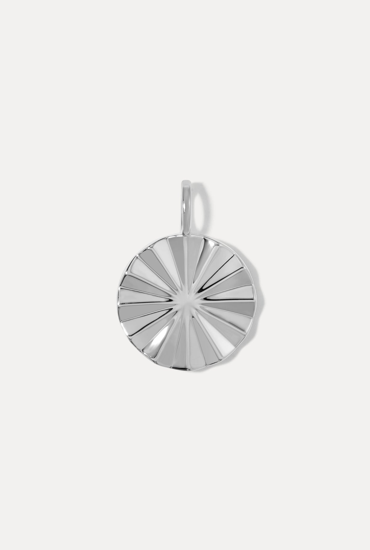 Bridget Silver Charm with a circular shape and textured sunburst pattern on a white background.