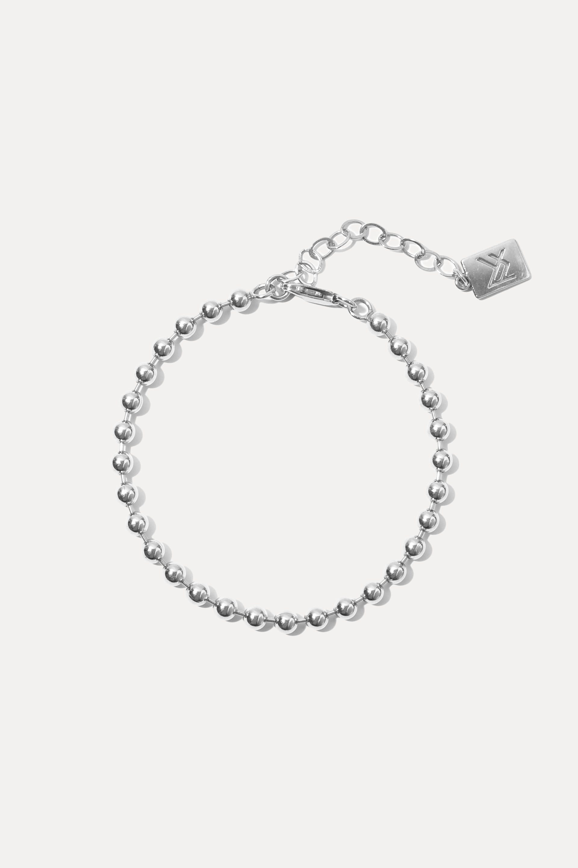 Sterling silver Fashion Jackson Bracelet displayed in a circle on a white background with extender and logo tag.