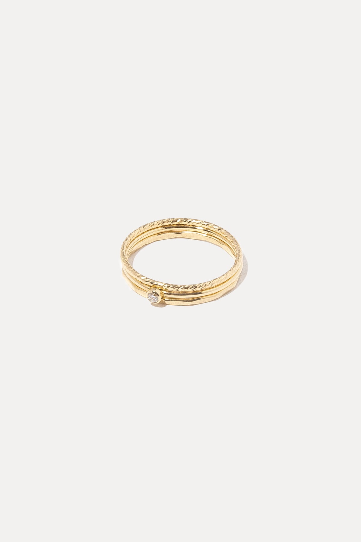 Detailed shot showing the pavé diamond setting, thin 14k gold band, and craftsmanship.