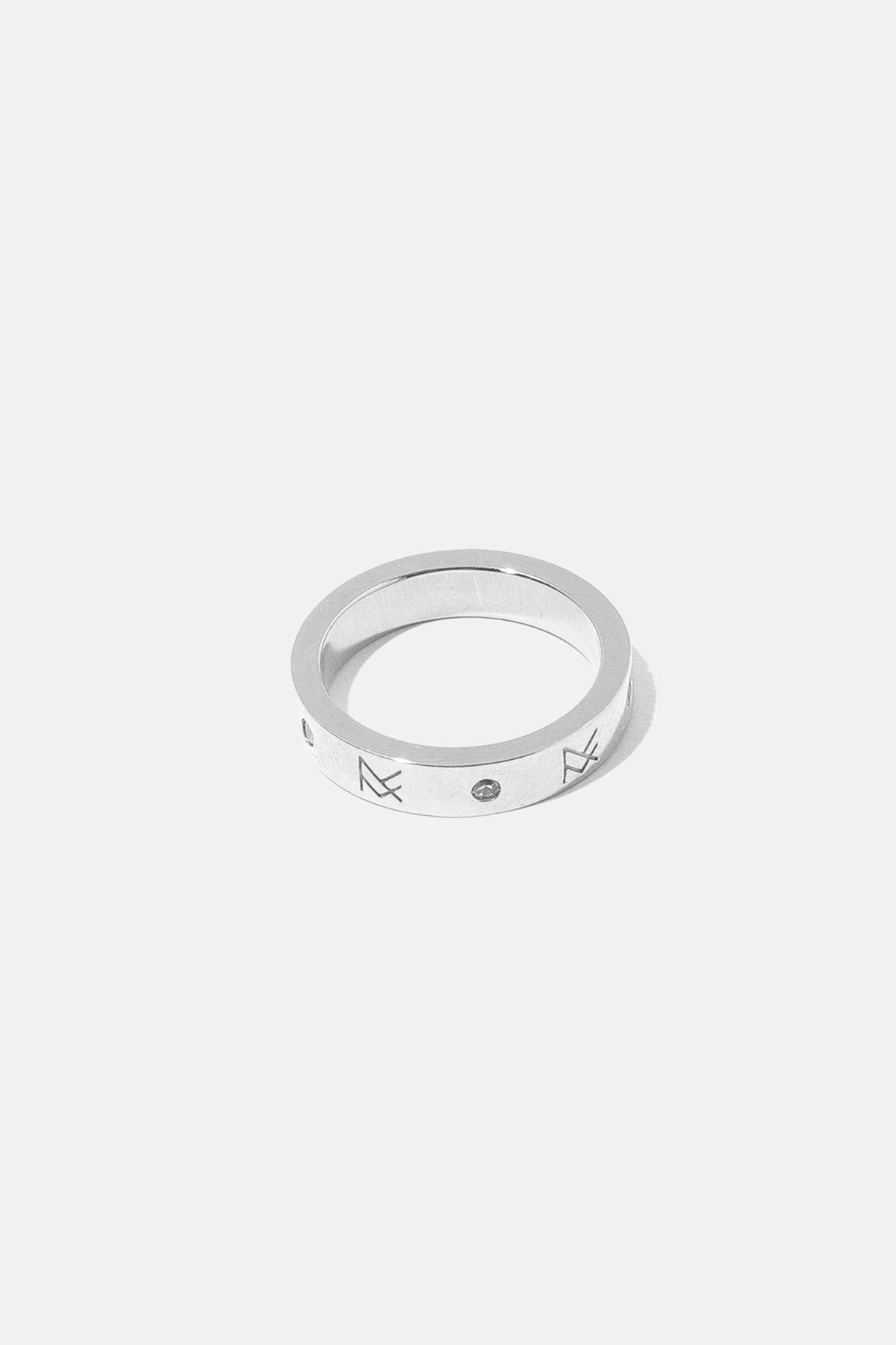 Silver MF ring featuring a detailed crest design, centered on a plain white background.