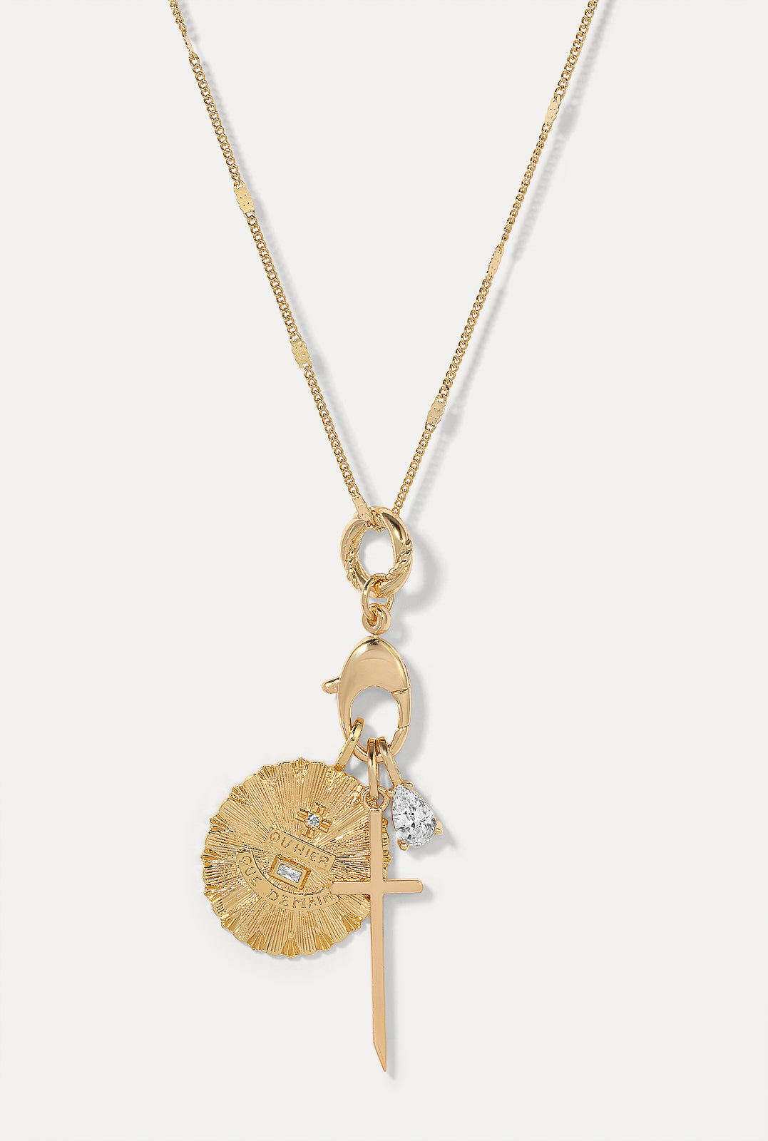 The Sutton charm paired with the Gia love and petite cross charms on coco gold cable chain.