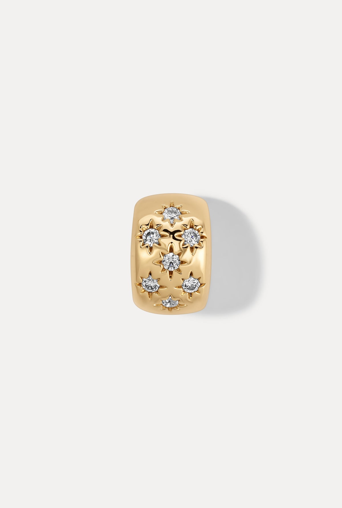 Gold Celeste slider charm with sparkling clear stones on white background