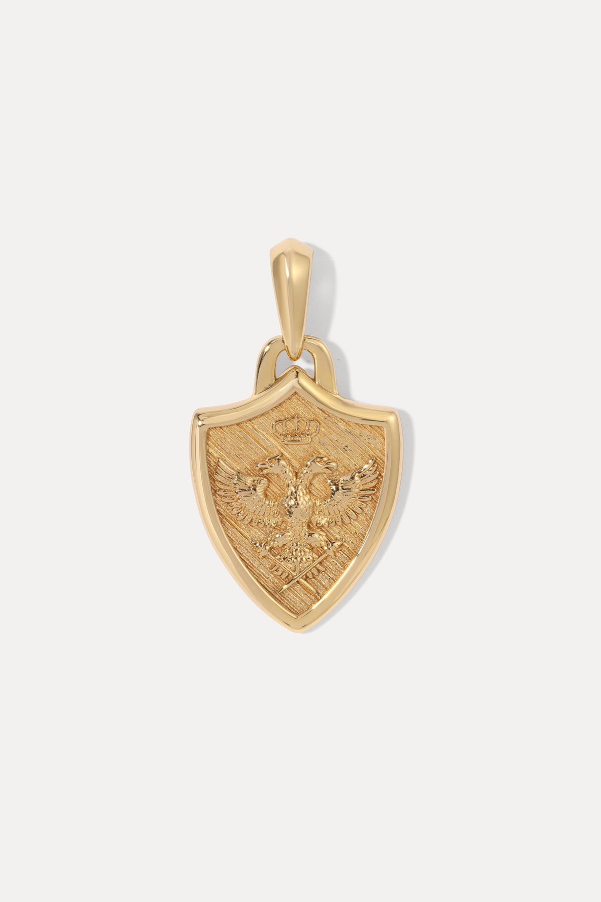 A gold shield-shaped pendant featuring an embossed double-headed eagle with a crown, displayed on a clean white background.
