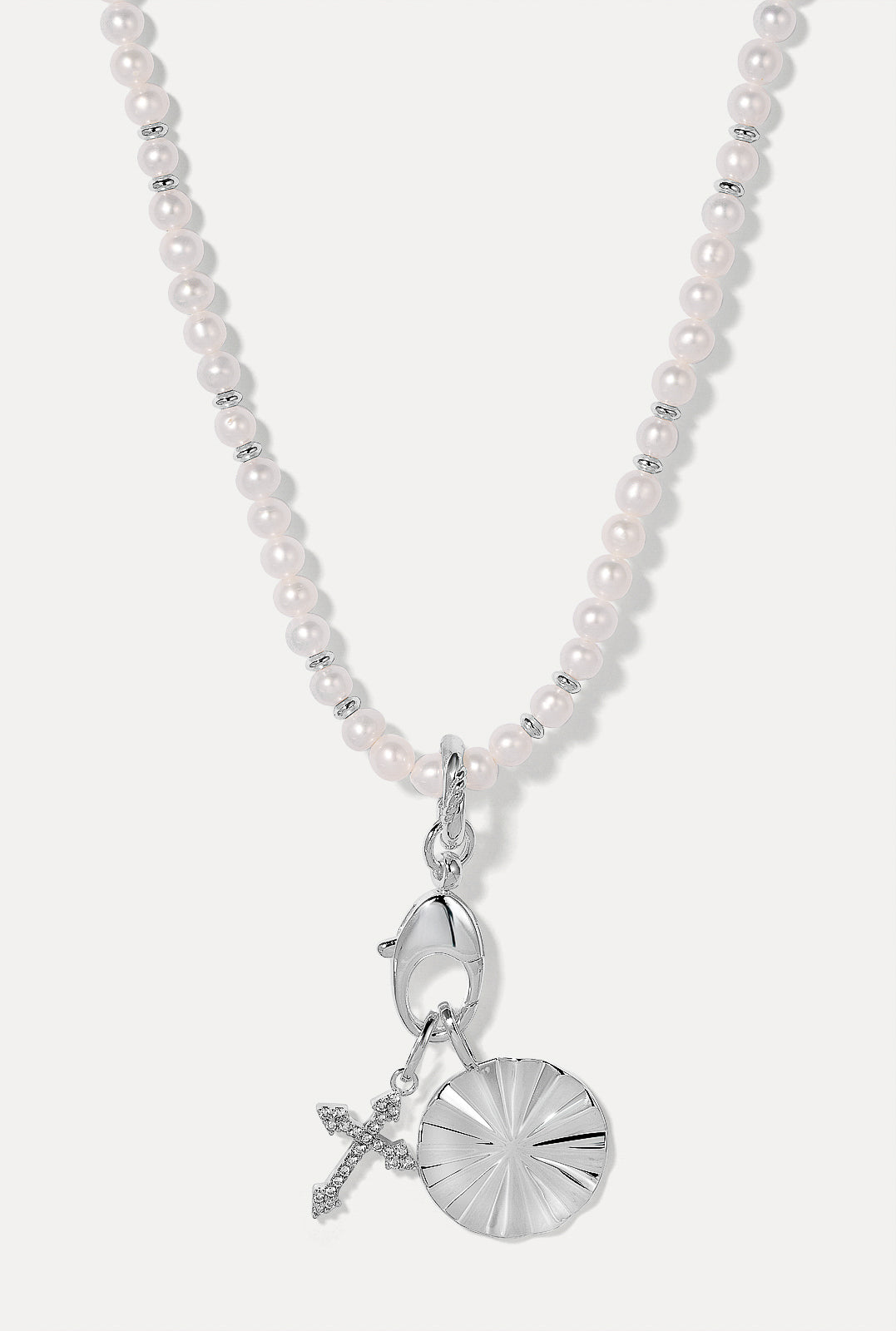 The Sutton charm in silver featured on the Betty pearl silver necklace with the harmony and Bridget charms in silver.