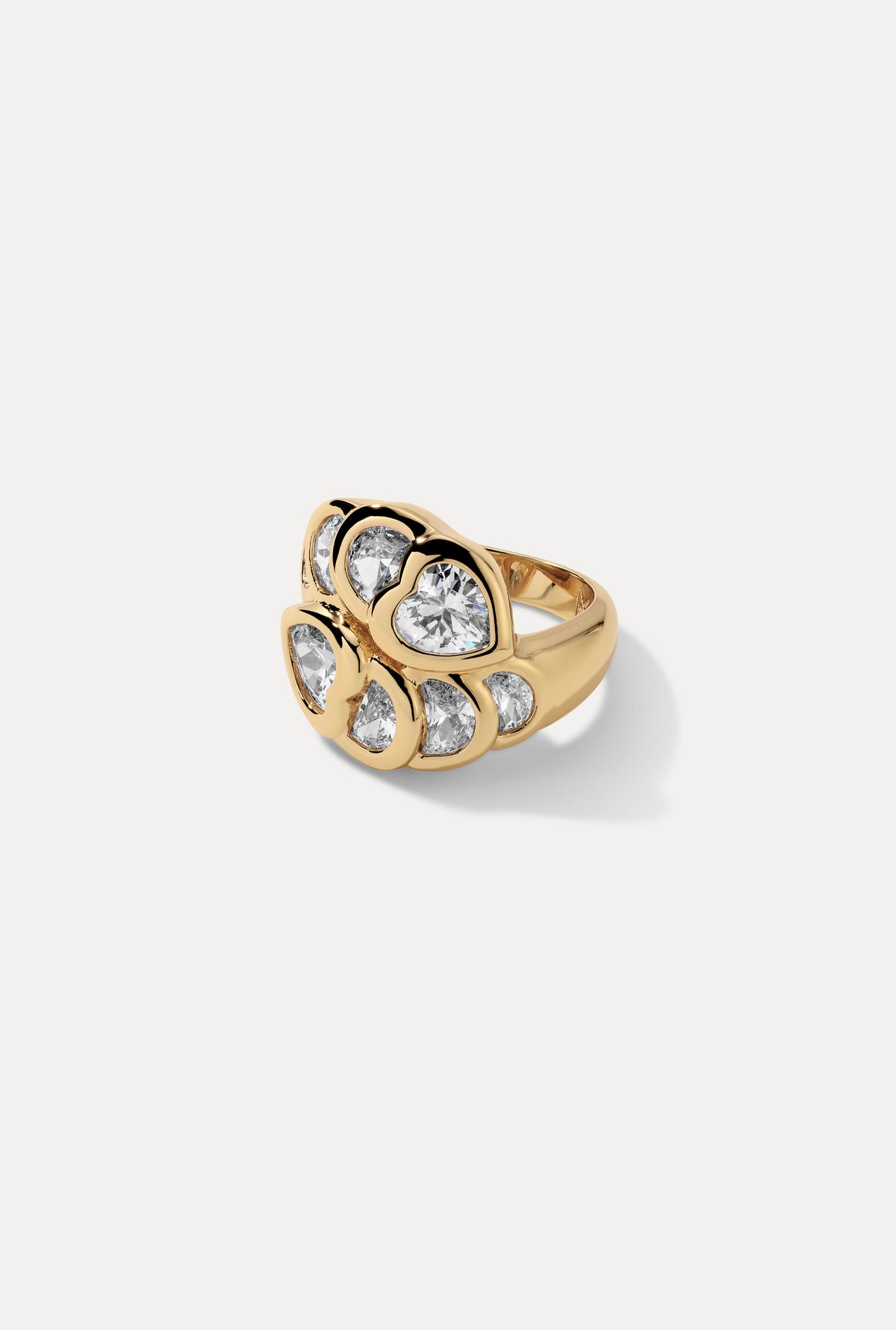 Gold Bardot statement cocktail ring featuring a cluster of heart-shaped CZ stones against a white backdrop.
