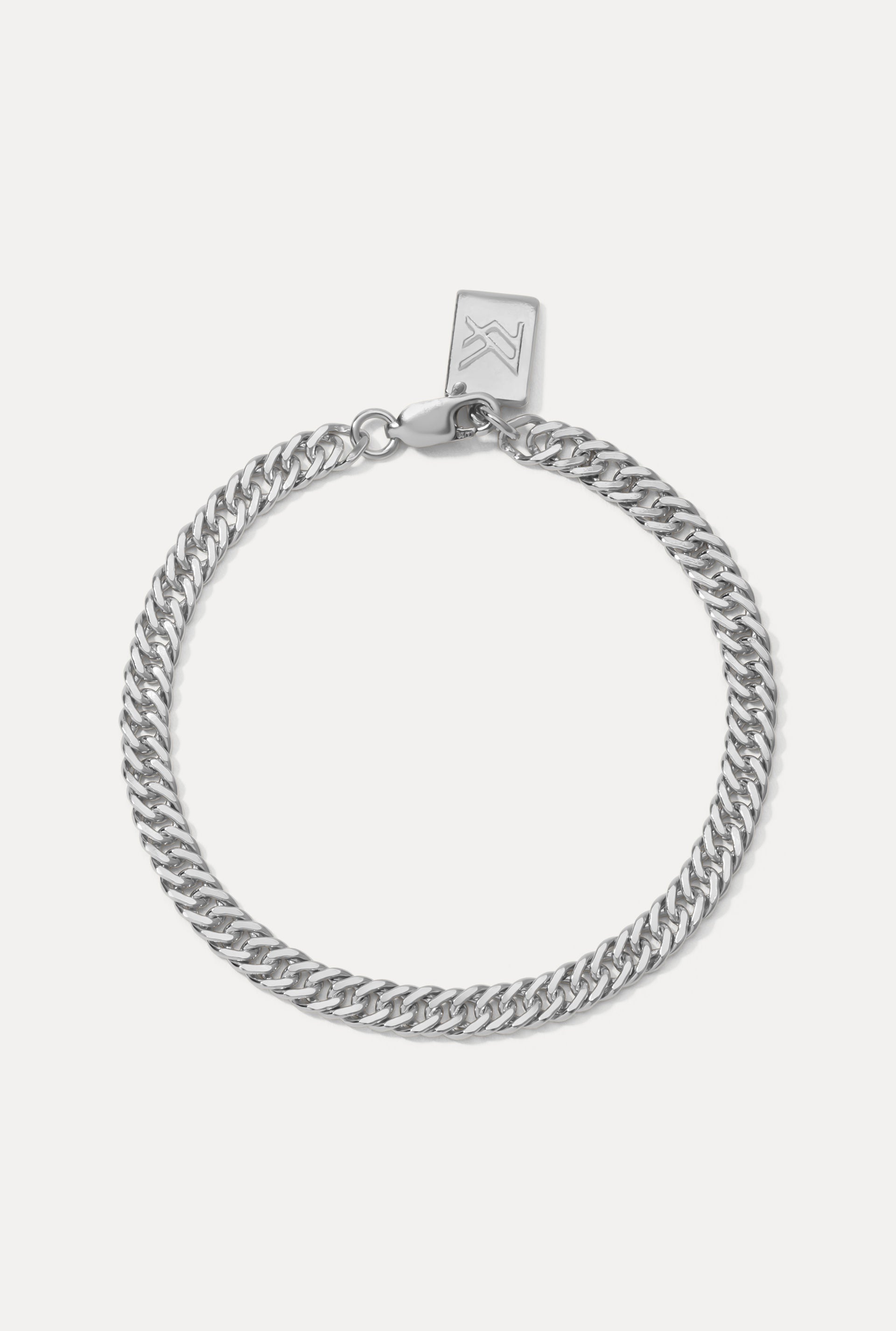 Sterling silver Blair Bracelet displayed in a circle on a white background with logo tag.