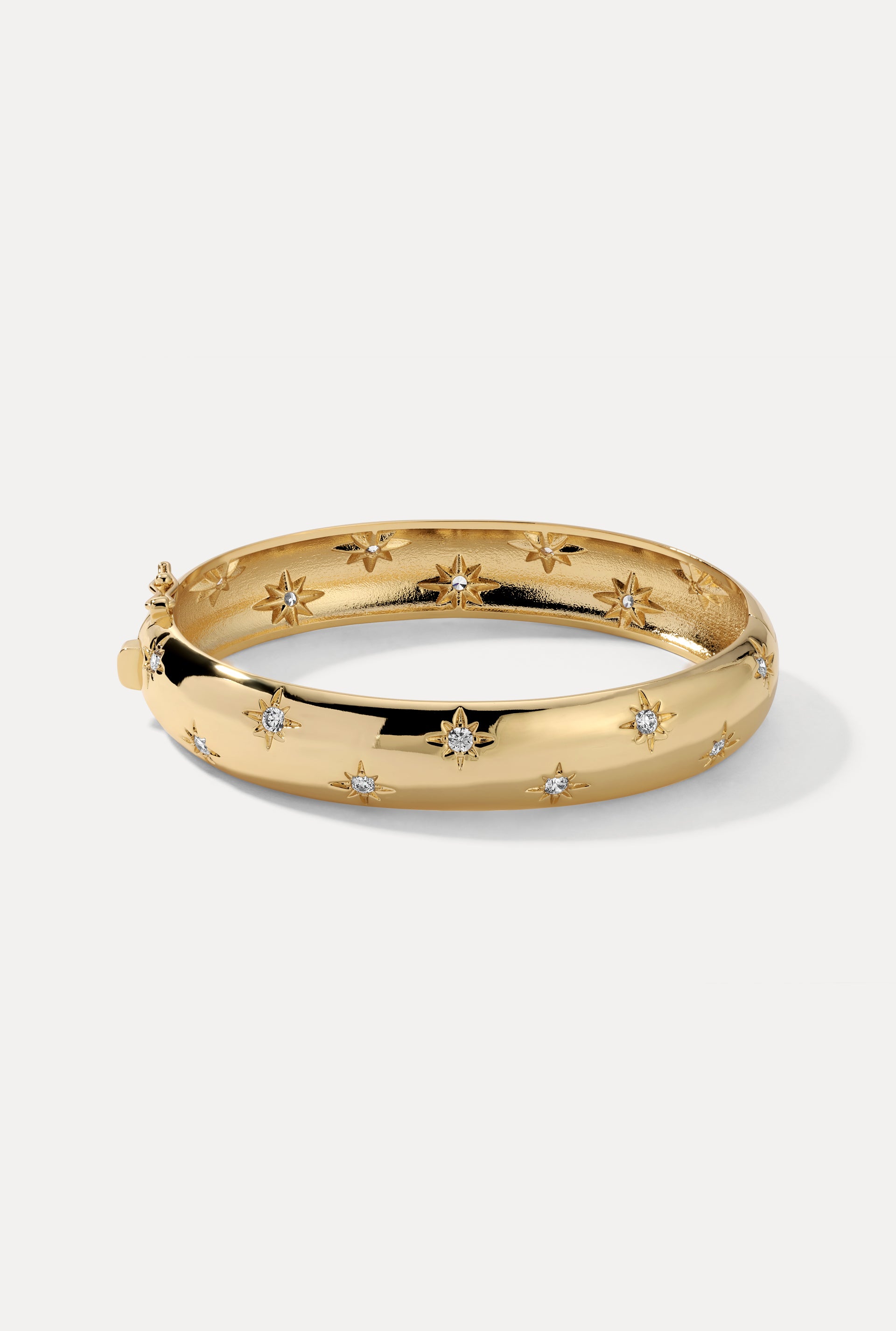 Gold Celeste Cuff with starburst CZ engravings displayed on a clean white background.