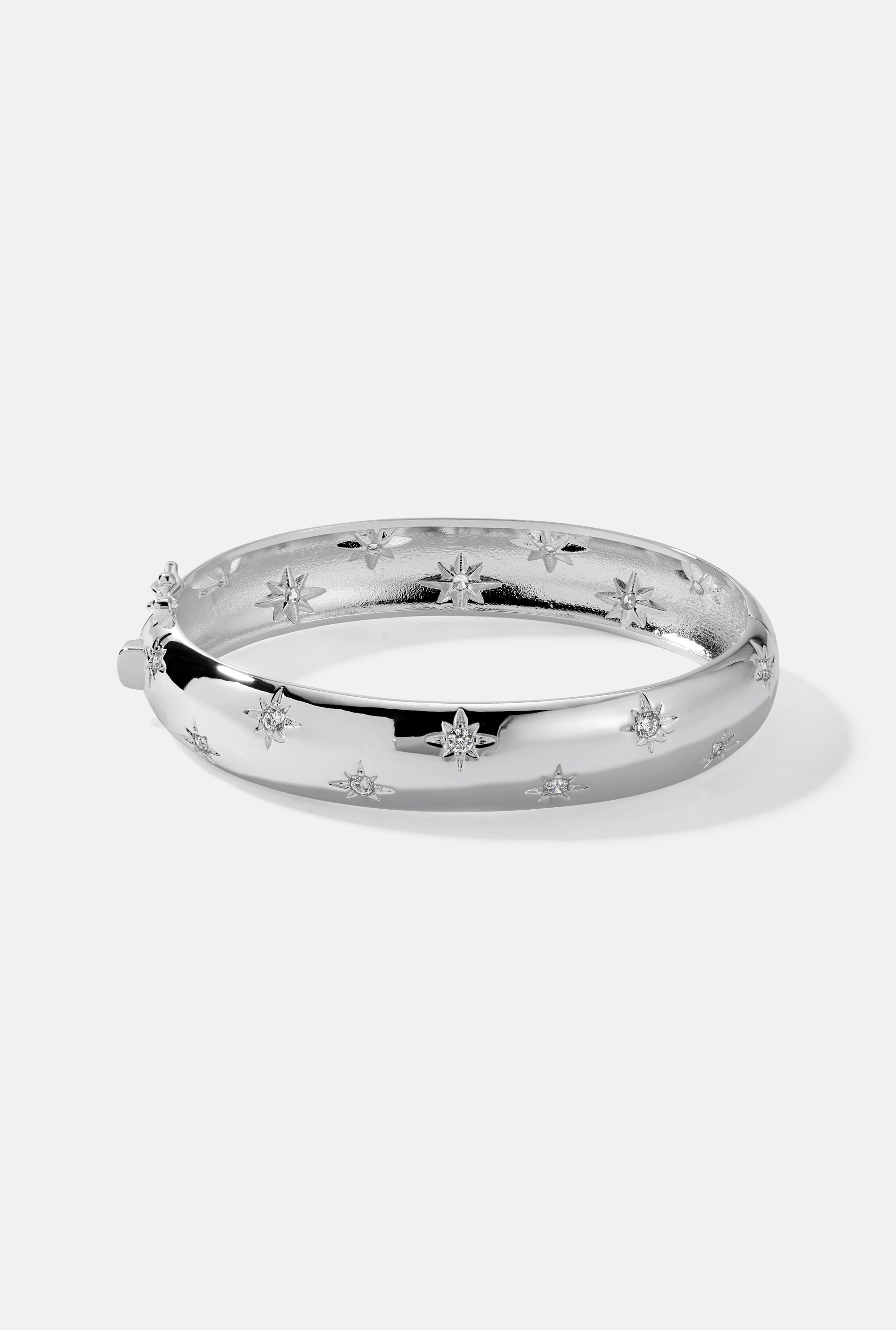 Silver Celeste Cuff with starburst CZ engravings displayed on a clean white background.