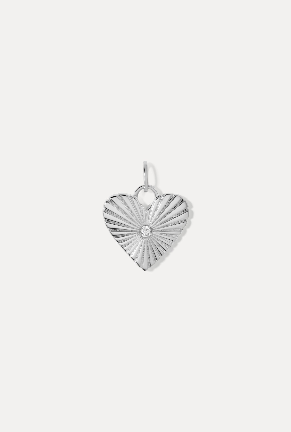 Silver Eleanor Charm featuring a radiant heart shape with textured grooves and a CZ stone on a white background.