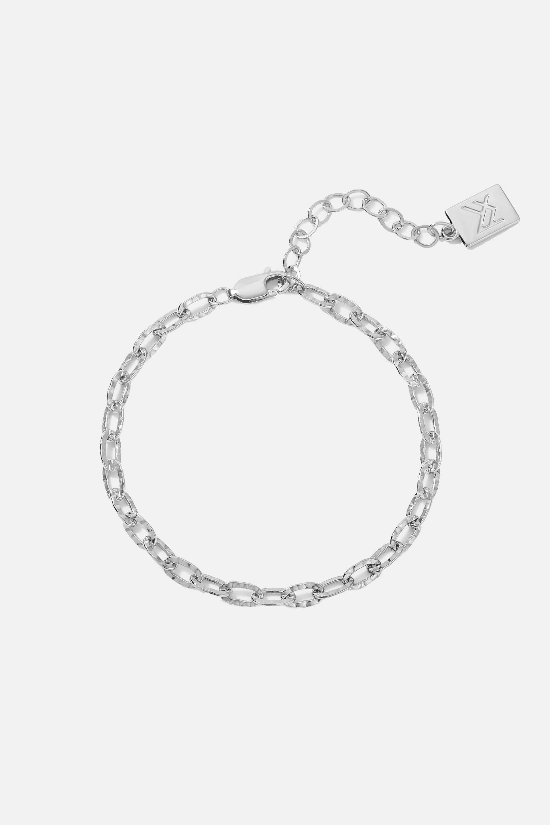 Sterling Silver Emily Bracelet displayed on a white background, showing its hammered chain links, extender, and logo tag.