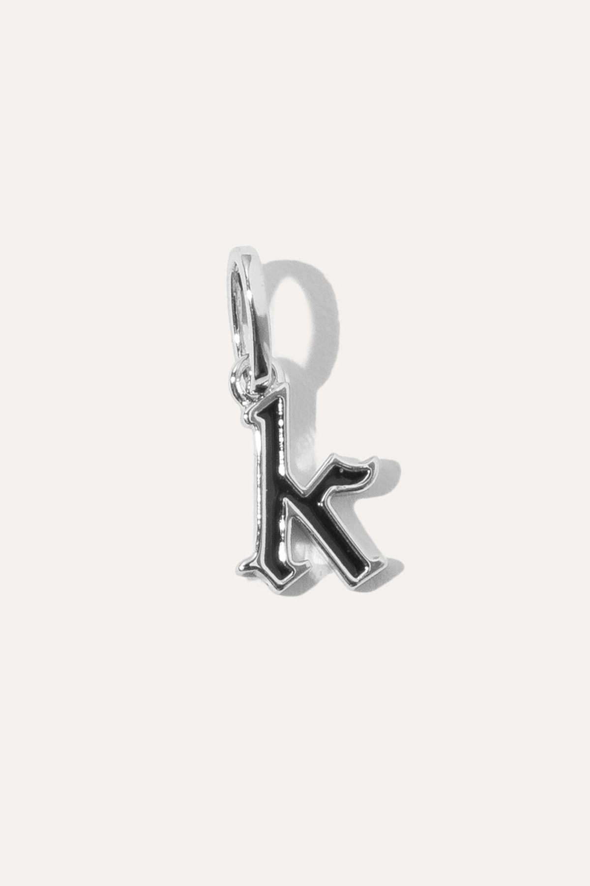 Silver Enamel Initial Charm in lowercase letter K with black enamel fill on a white background.