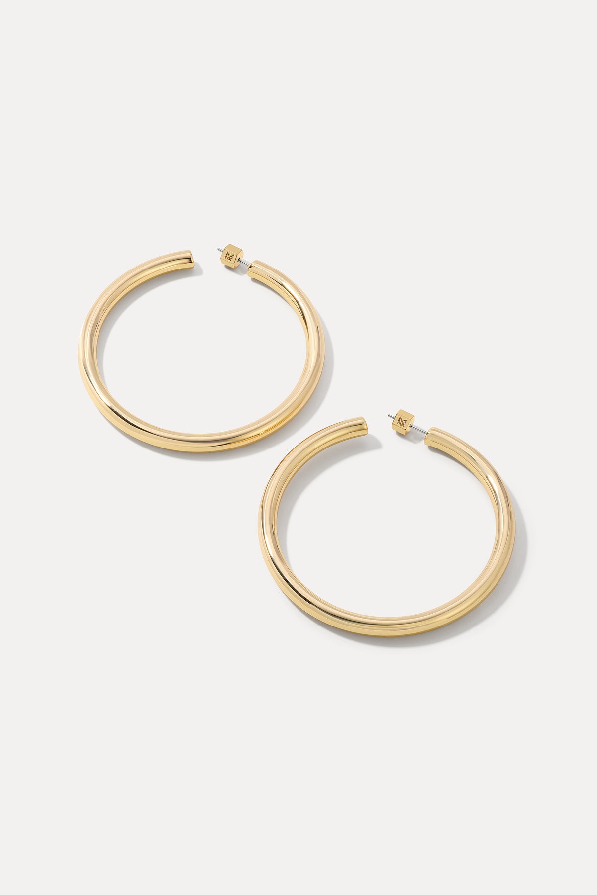Pair of gold Harper Hoops displayed on a clean white background.