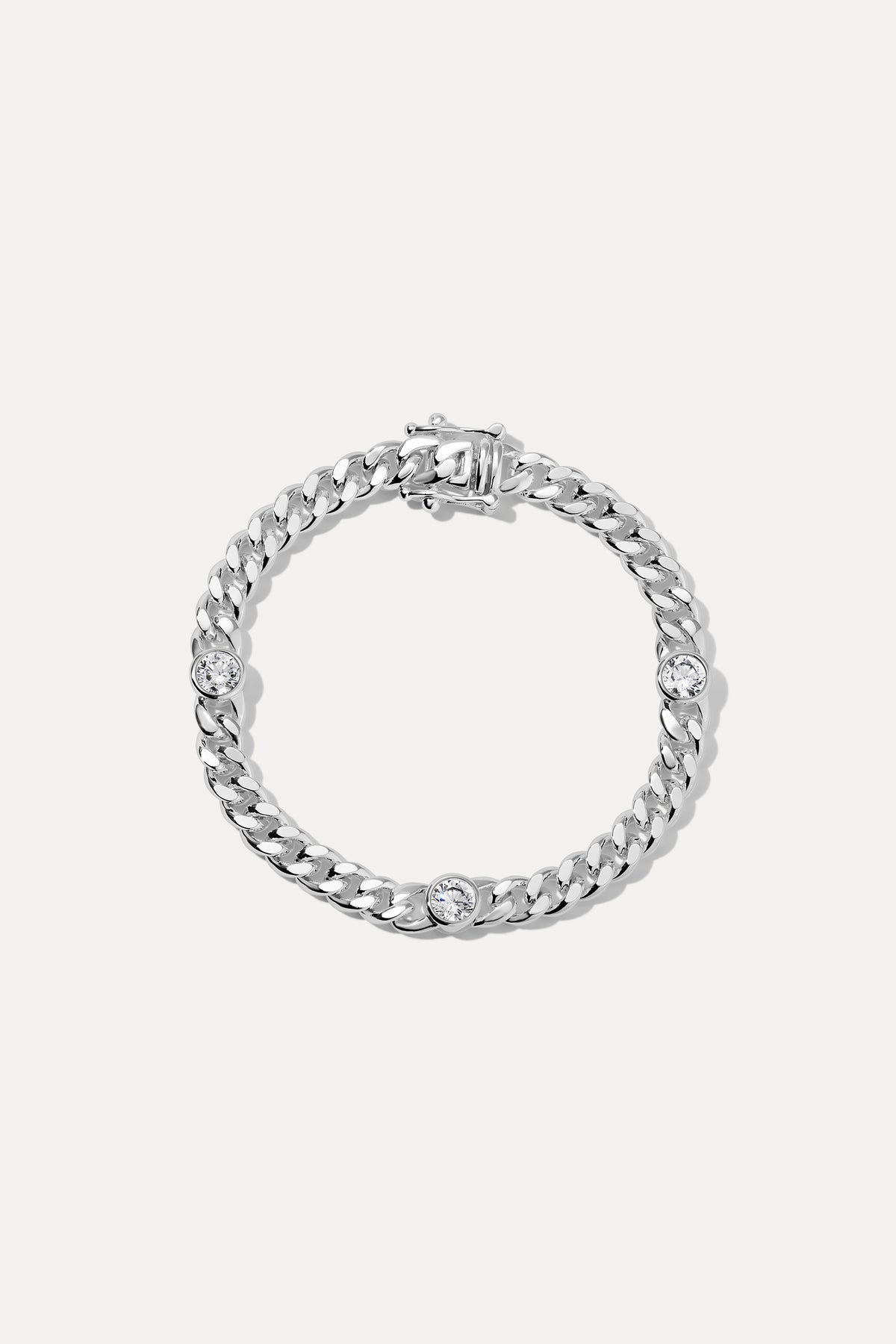 Silver Josie curb chain bracelet with bezel-set CZ stones displayed in a circle on a white background.