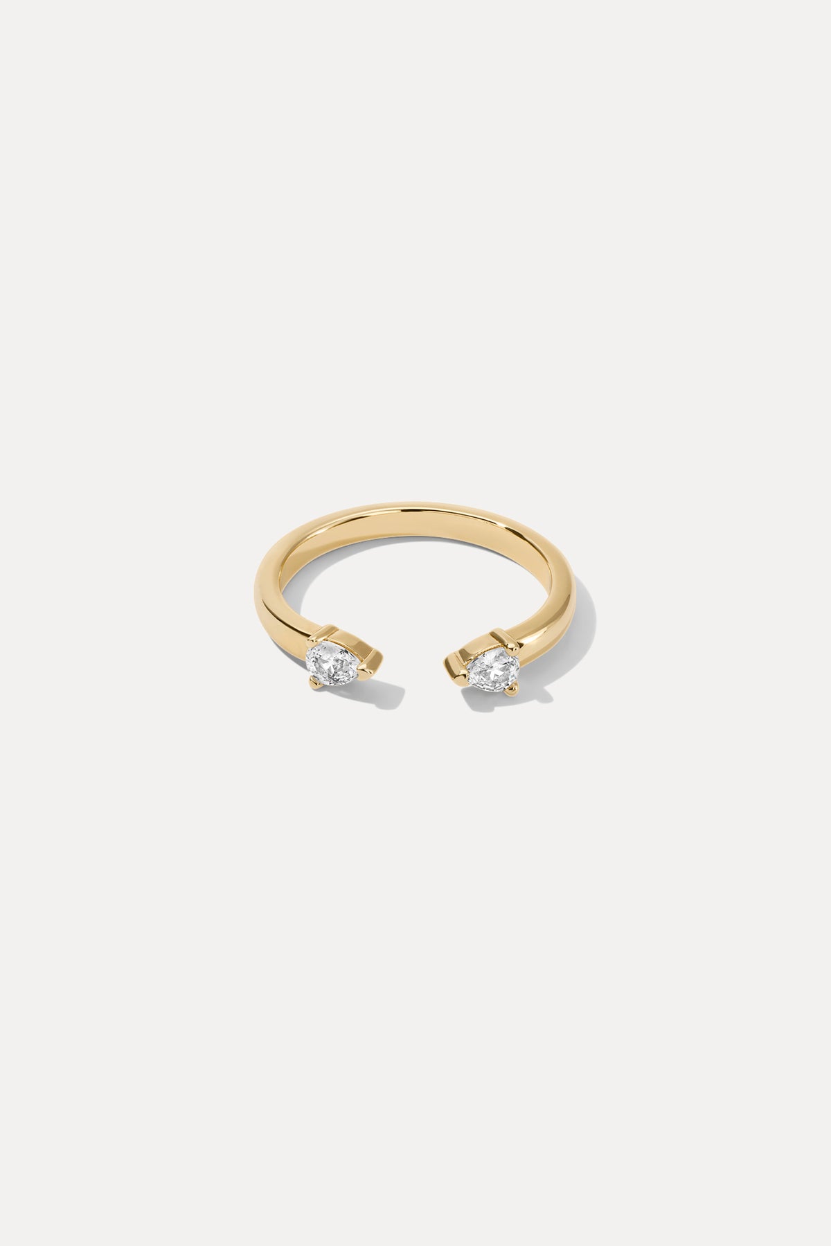 Gold Lyra ring featuring a delicate band and polished finish, centered on a plain white background.
