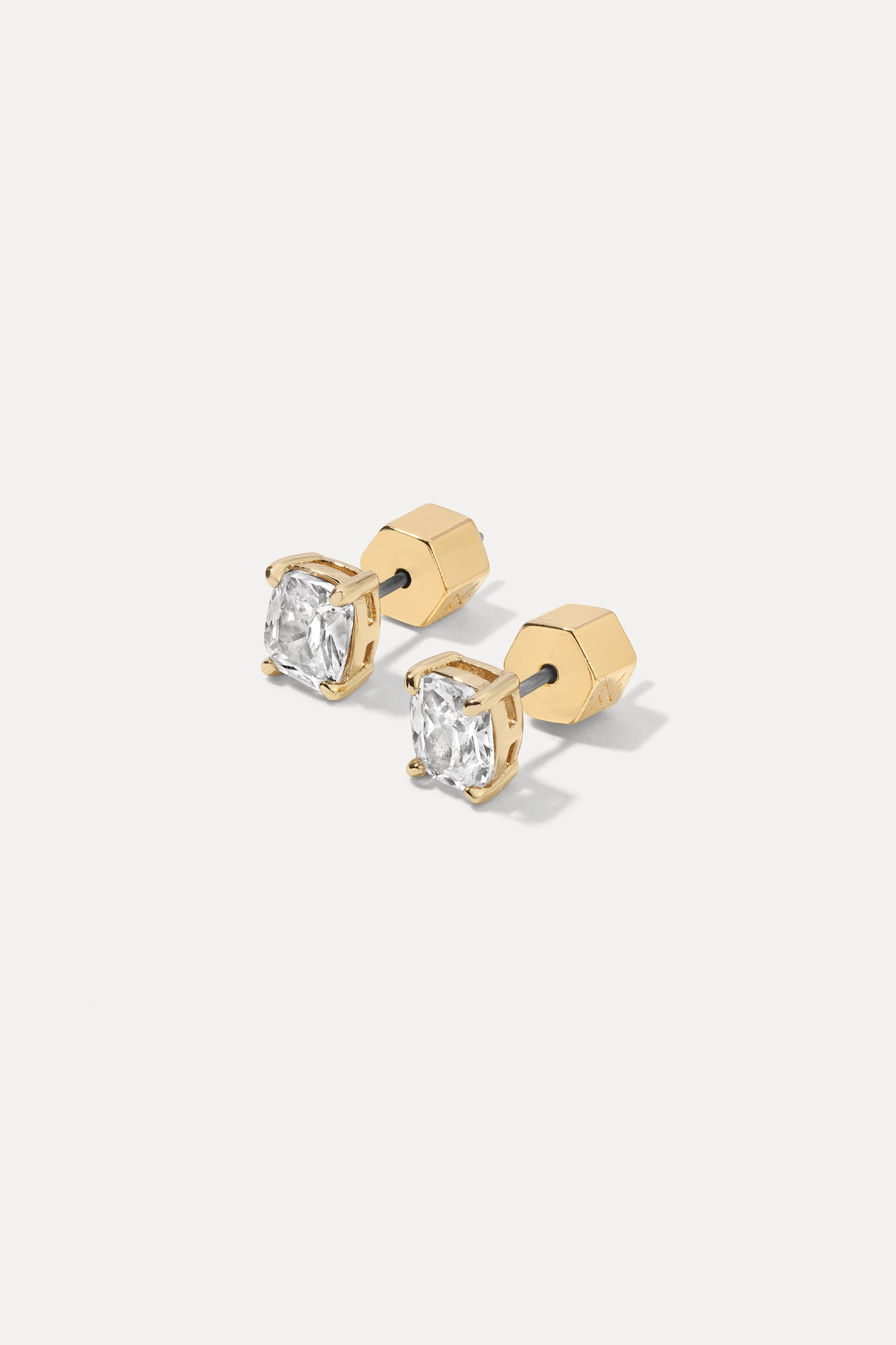 Pair of gold Sophia Studs featuring cushion-cut cubic zirconia stones on a white background.