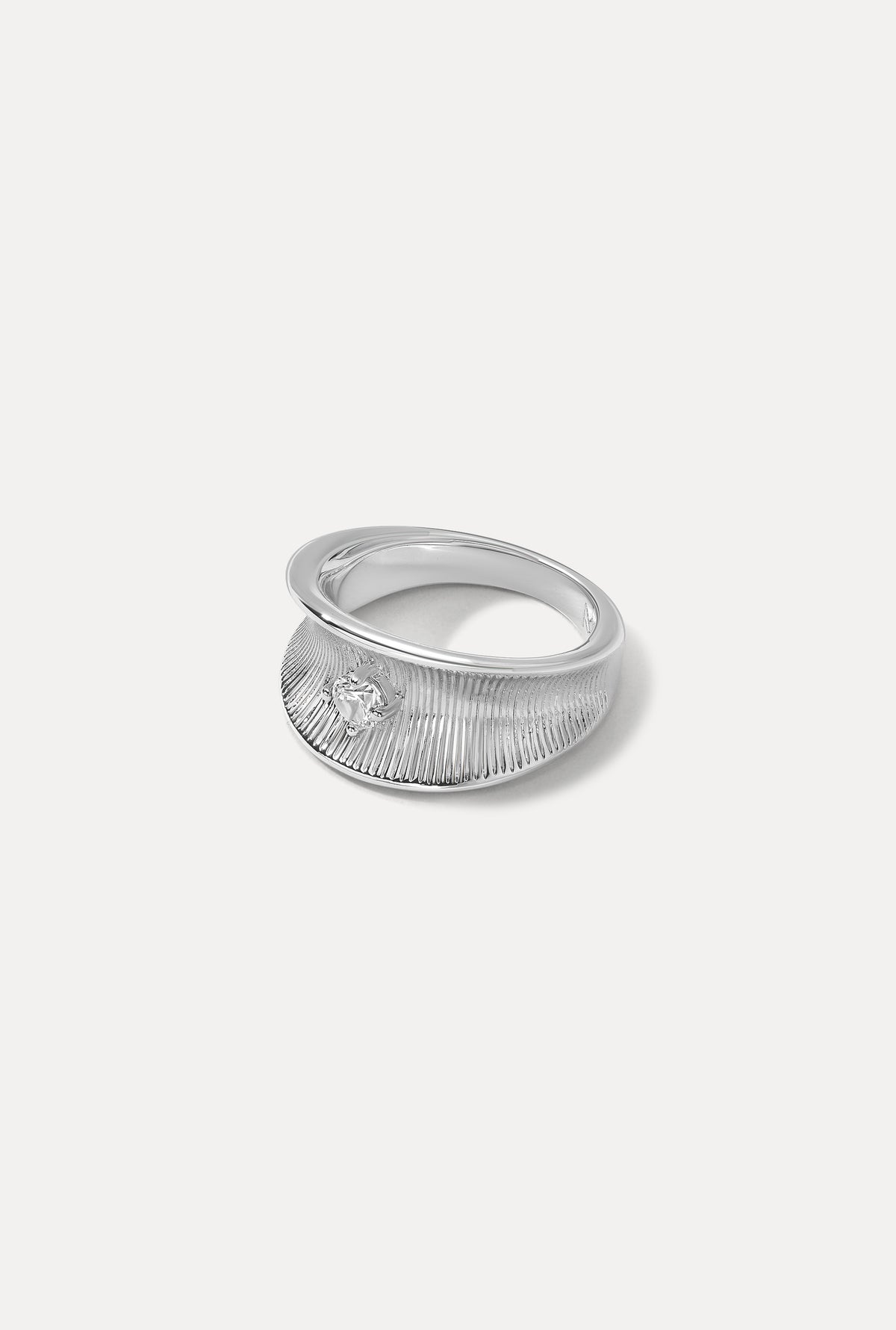 Silver Anne Marie ring featuring a tapered ribbed design with a sparkling CZ accent on a white backdrop.
