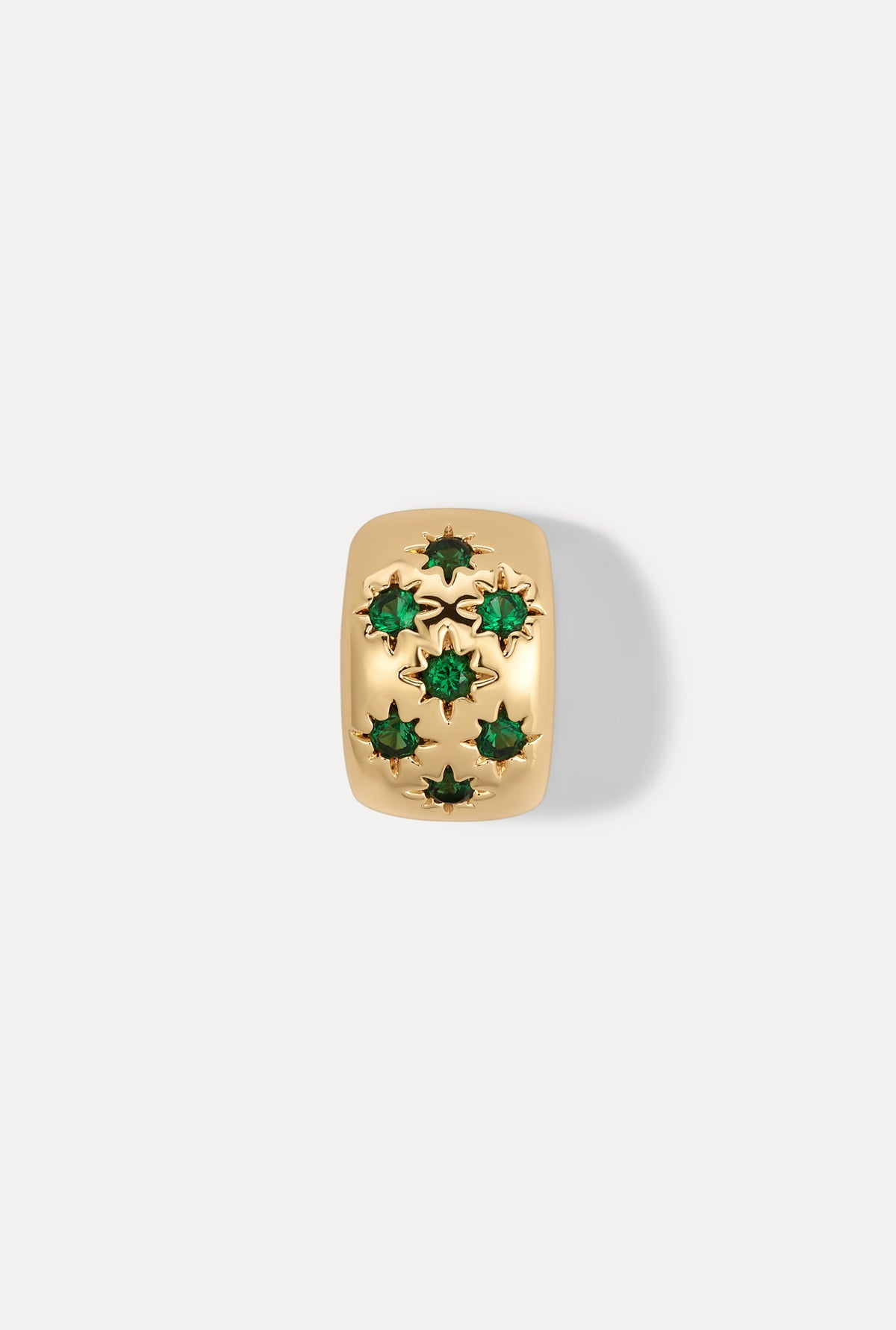 Gold Celeste slider charm with sparkling emerald stones on white background