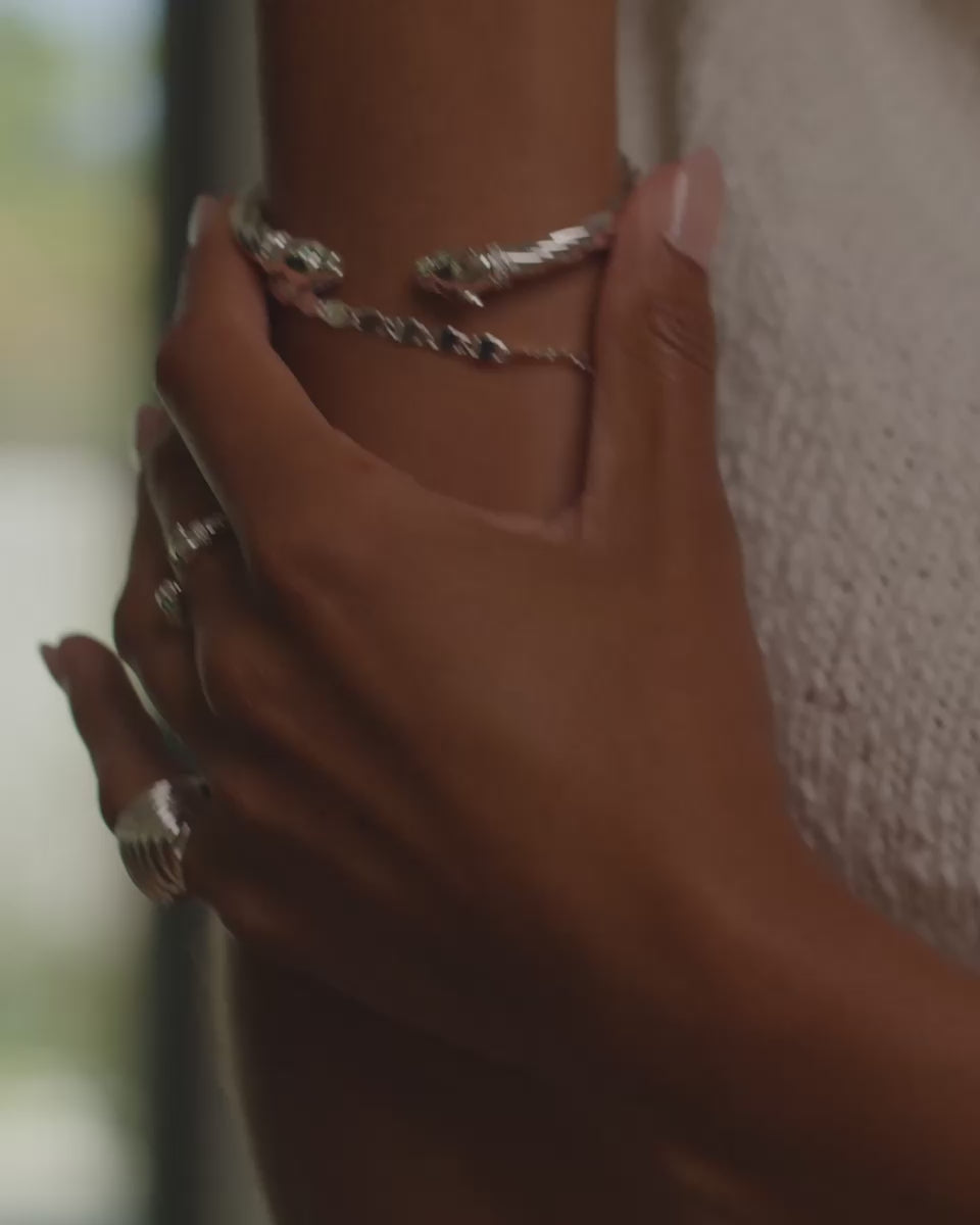 Model video showcasing The panther bracelet cuff stacked with other Miranda Frye bracelets and rings.